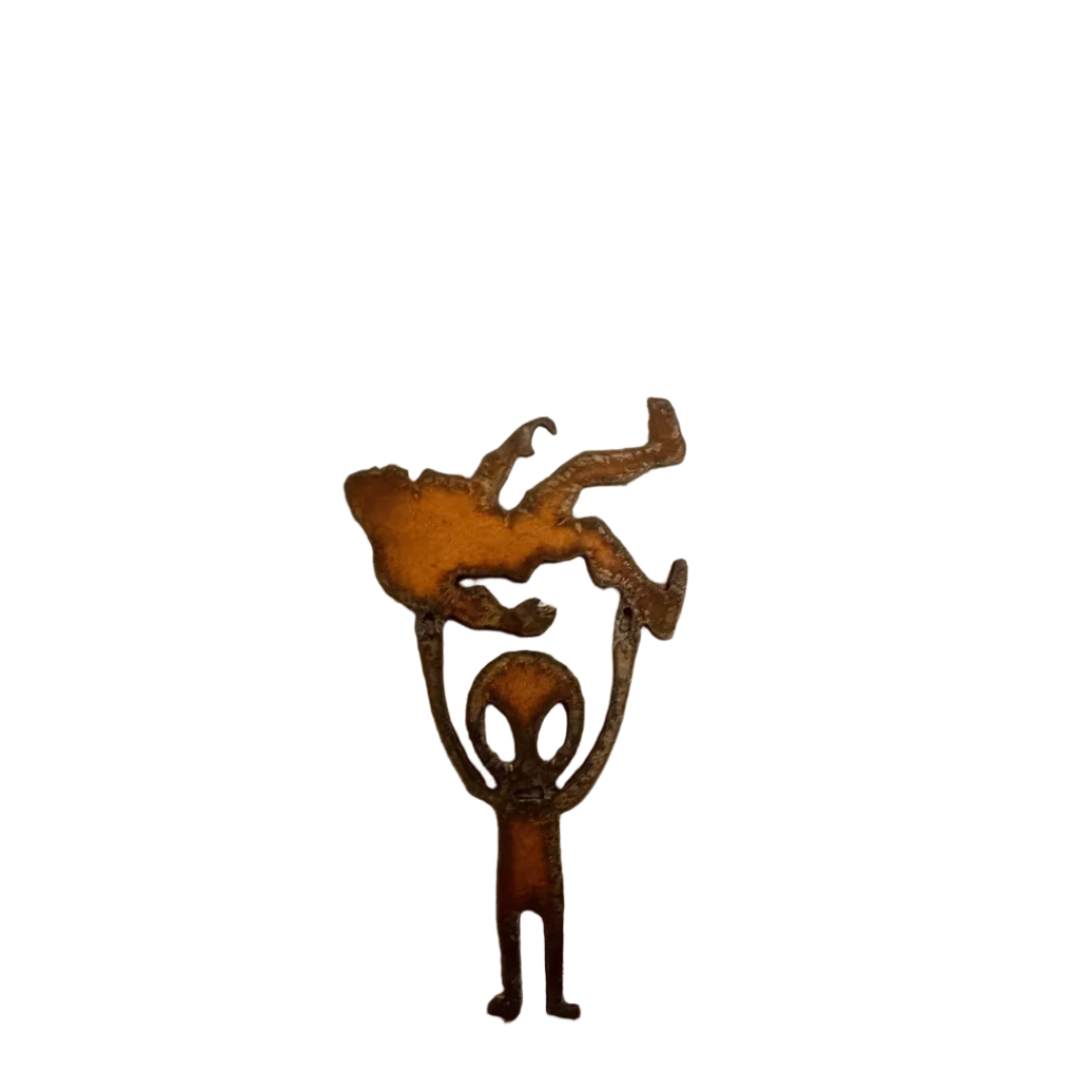 Alien Holding Bigfoot Rustic Metal Magnet