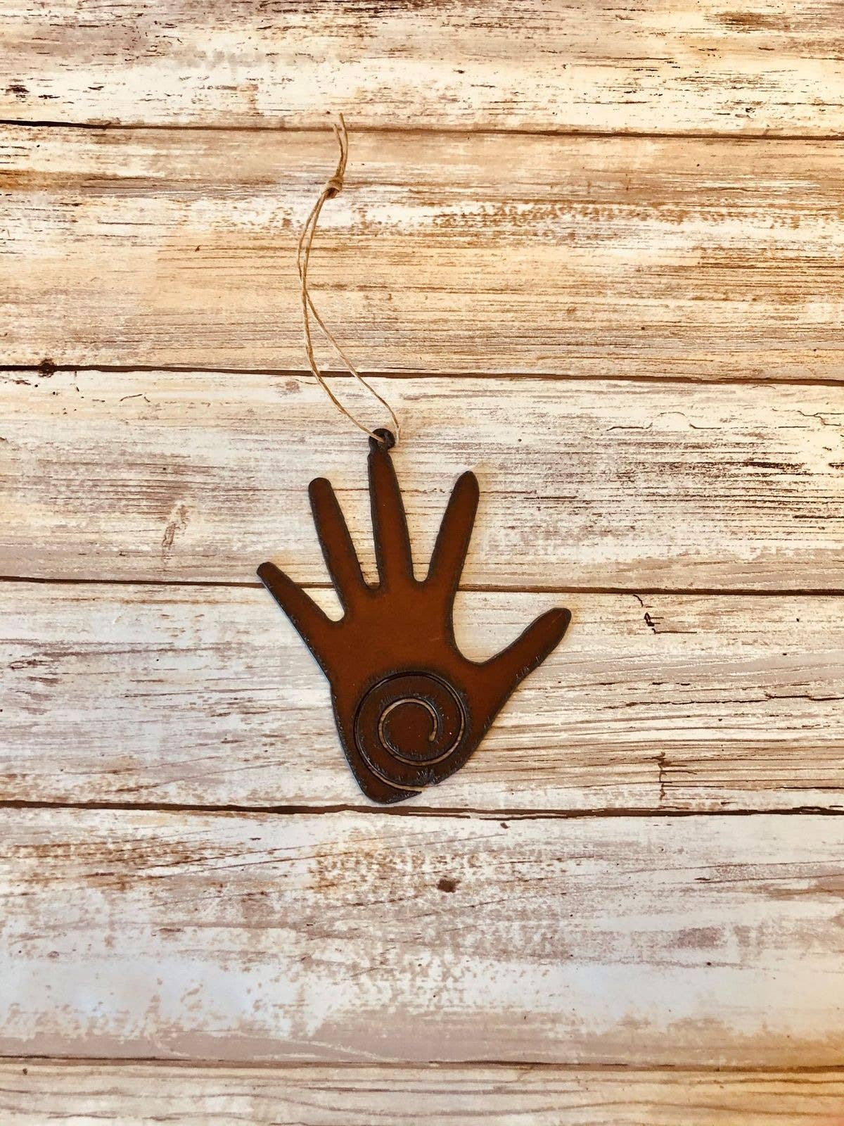 Hand With Swirl Ornament